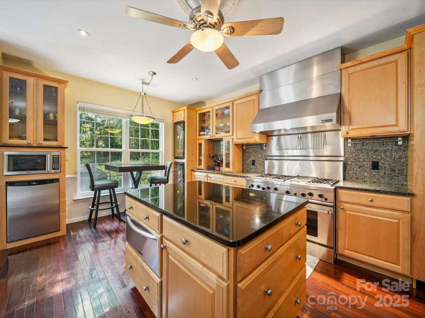 16411 Greybriar Forest Lane, Charlotte, NC 28278.  MLS# CAR4273245, YatesRealty ID 22845. Kitchen Island with proofing/warming drawer