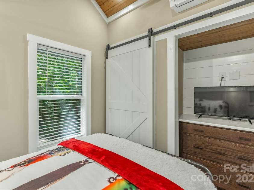 3095 Silversteen Road, Lake Toxaway, NC 28747.  MLS# CAR4269912, YatesRealty ID 22856. Sliding door moves to access closet