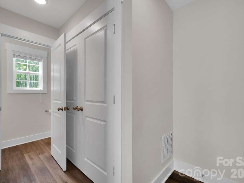 2877 Vale Avenue, Kannapolis, NC 28081.  MLS# CAR4366966, YatesRealty ID 22857. Laundry Closet and door to the Powder Room (don't you love that it's tucked away from the living area!)