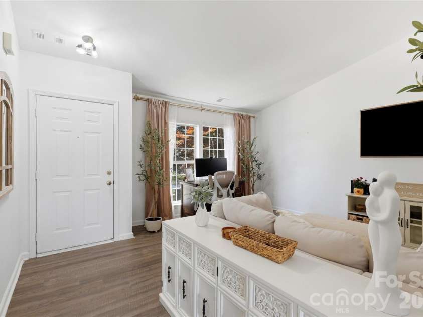 1007 Great Falls Drive, Monroe, NC 28110.  MLS# CAR4382454, YatesRealty ID 22866. Cozy front living room