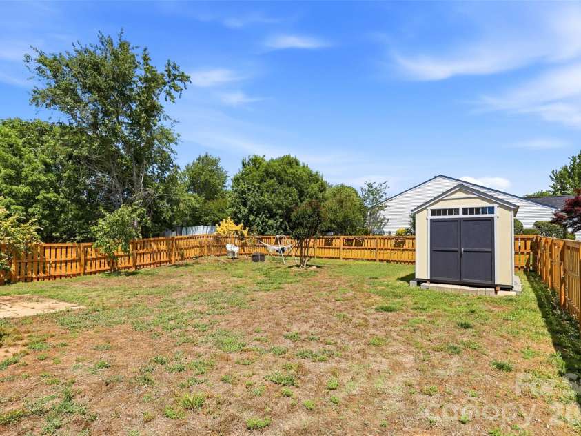 1007 Great Falls Drive, Monroe, NC 28110.  MLS# CAR4382454, YatesRealty ID 22866. Fully fenced, level backyard- so many outdoor possibilities!