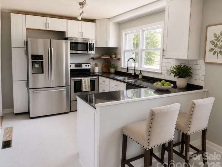 305 Forestway Drive, Mount Holly, NC 28120.  MLS# CAR4378844, YatesRealty ID 22874. Kitchen Virtually staged