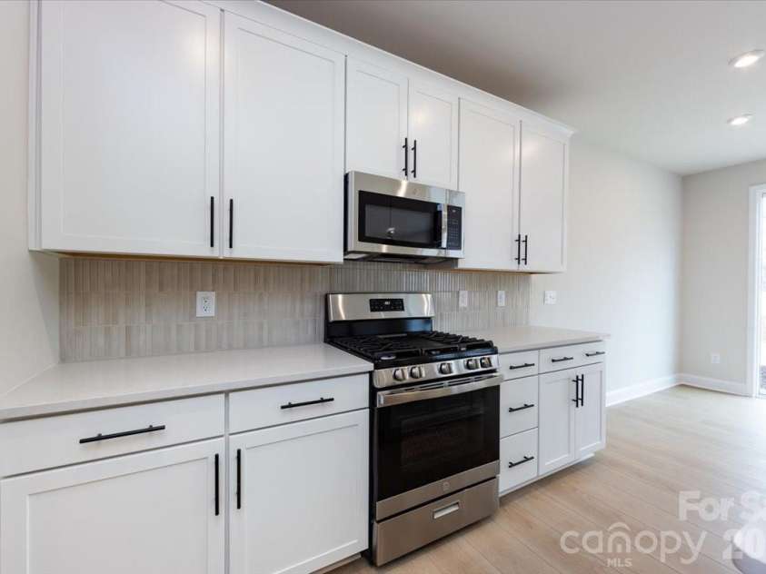 155 Landy Street, Fort Mill, SC 29715.  MLS# CAR4351412, YatesRealty ID 22875. Kitchen with gas range