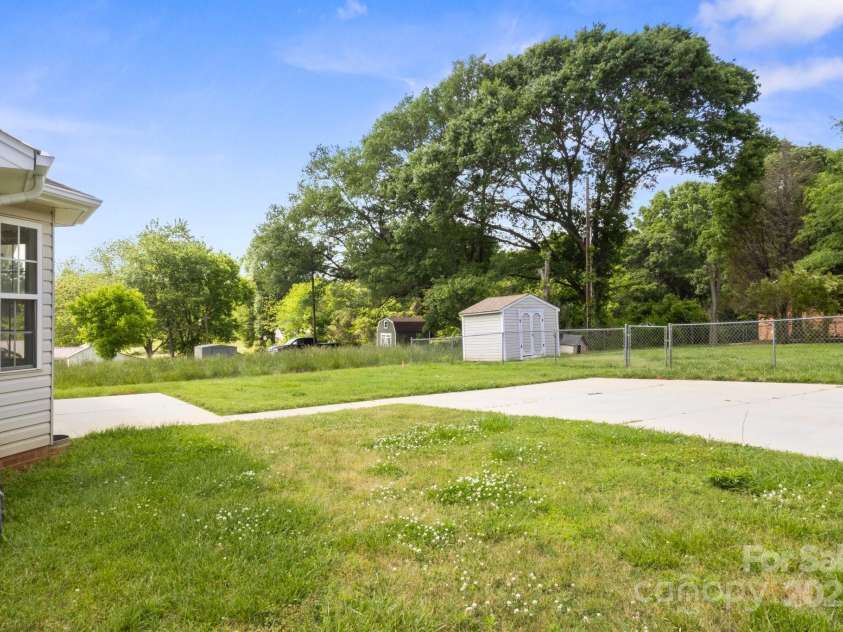 318 Huffman Road, Gastonia, NC 28056.  MLS# CAR4250230, YatesRealty ID 22875. Back Yard w/extra fenced-in lot