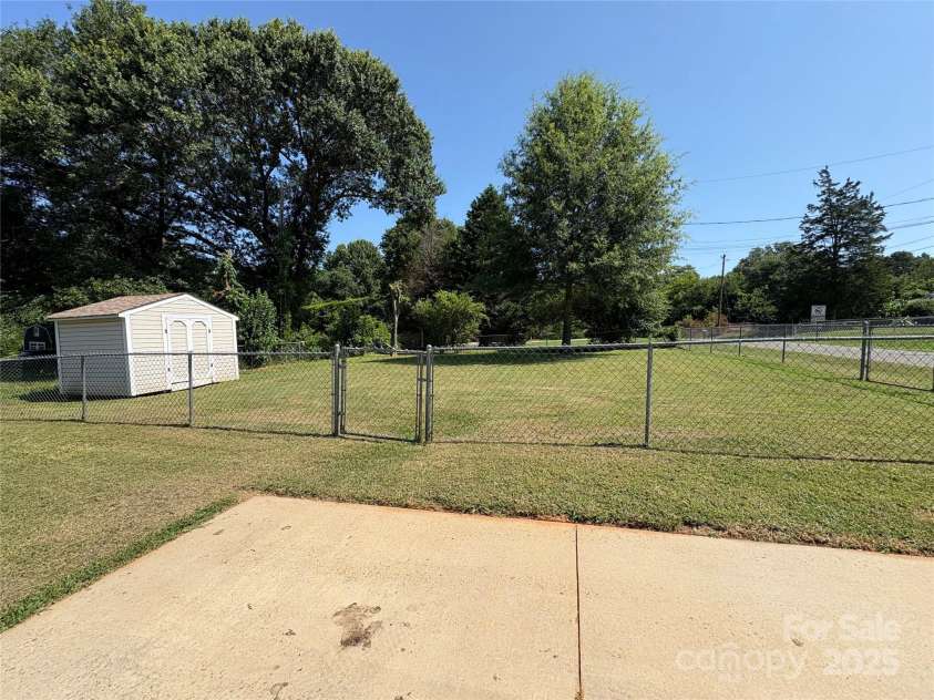 318 Huffman Road, Gastonia, NC 28056.  MLS# CAR4250230, YatesRealty ID 22875. Back Yard w/extra fenced-in lot