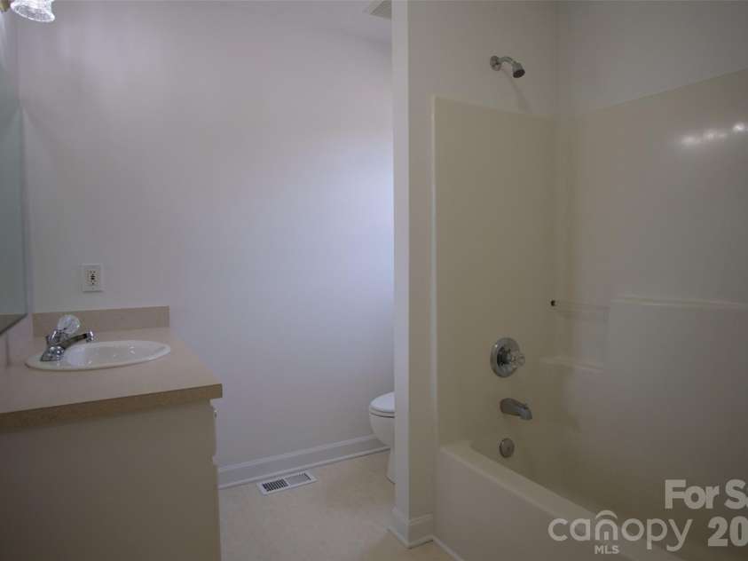 318 Huffman Road, Gastonia, NC 28056.  MLS# CAR4297104, YatesRealty ID 22875. Primary bedroom's attached bathroom.