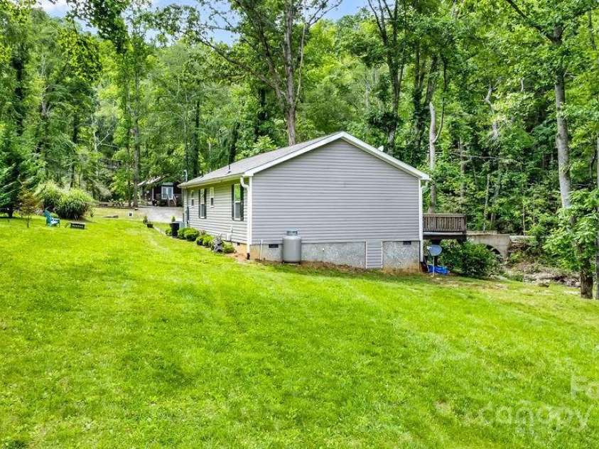 57 Fair Hollow Lane, Hendersonville, NC 28792.  MLS# CAR4268664, YatesRealty ID 22877. Back side of main house