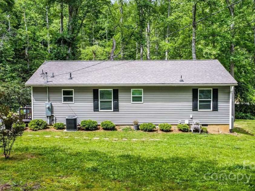 57 Fair Hollow Lane, Hendersonville, NC 28792.  MLS# CAR4268664, YatesRealty ID 22877. Side of main house