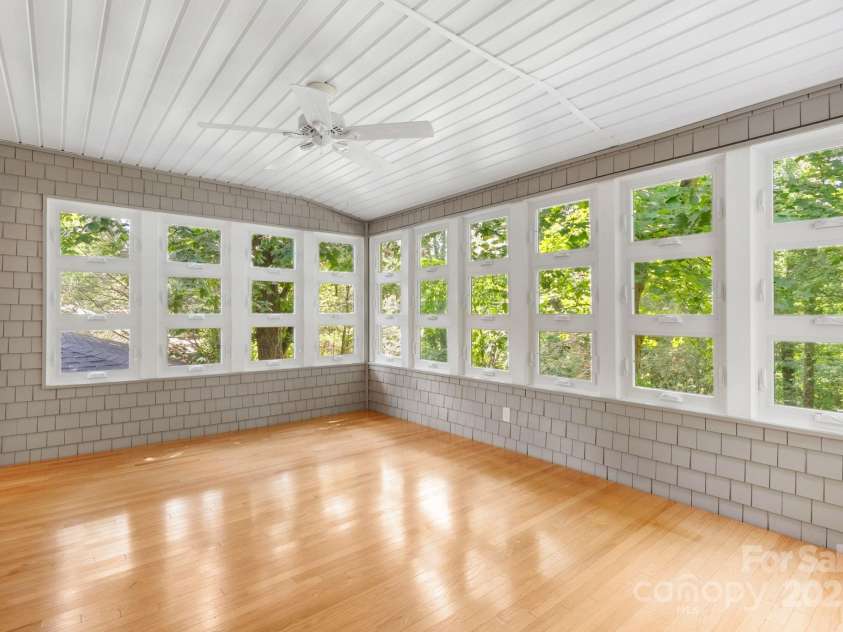 115 Aurora Drive, Asheville, NC 28805.  MLS# CAR4273830, YatesRealty ID 22887. Expansive heated sun porch/bonus room