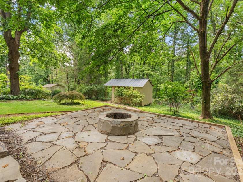 115 Aurora Drive, Asheville, NC 28805.  MLS# CAR4273830, YatesRealty ID 22887. Fire pit, artist studio and shed