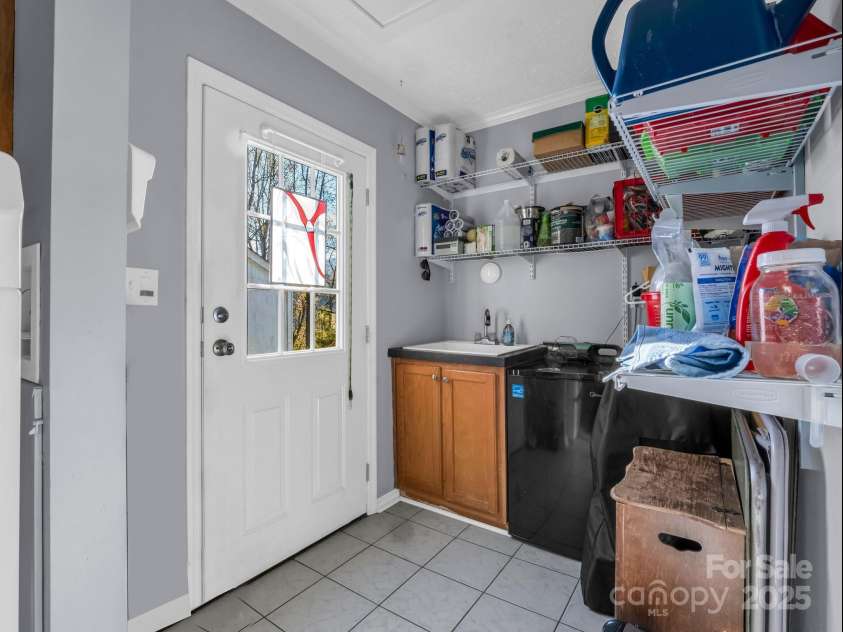 22 Shallow Branch Road, Leicester, NC 28748.  MLS# CAR4195213, YatesRealty ID 2290. Mud Room Built In Wash Sink