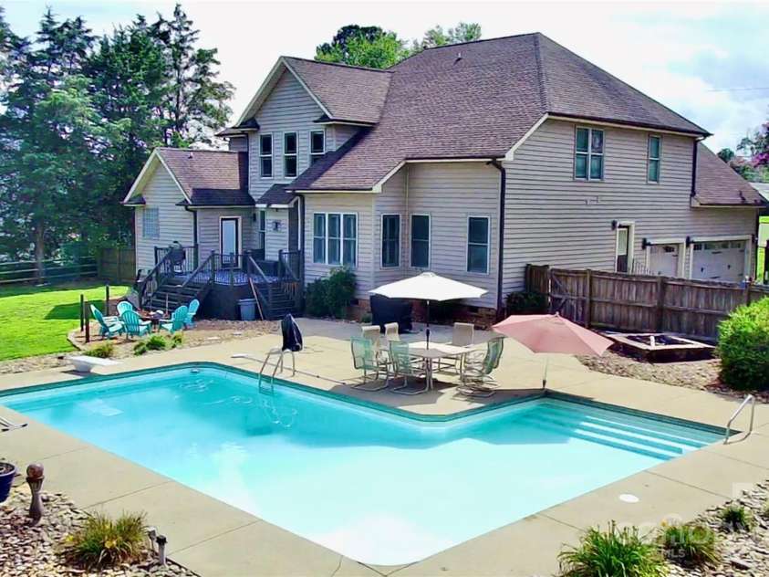 141 Weathers Creek Road, Troutman, NC 28166.  MLS# CAR4264721, YatesRealty ID 22900. Beautiful backyard entertaining area.