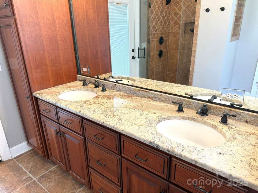 141 Weathers Creek Road, Troutman, NC 28166.  MLS# CAR4264721, YatesRealty ID 22900. Dual vanity in the primary bathroom