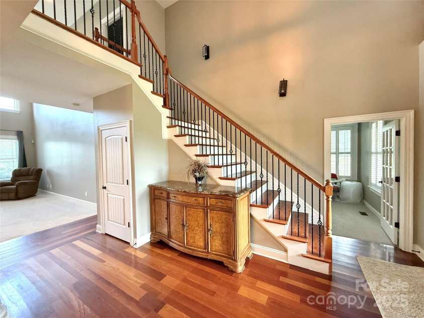 141 Weathers Creek Road, Troutman, NC 28166.  MLS# CAR4264721, YatesRealty ID 22900. Entryway and stairs to upper level.