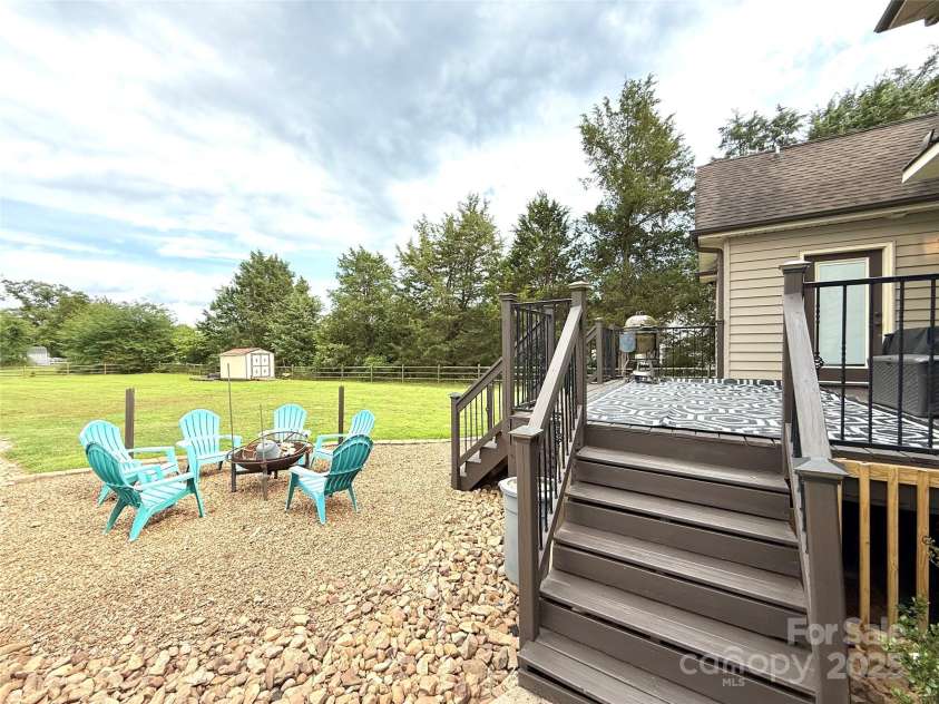 141 Weathers Creek Road, Troutman, NC 28166.  MLS# CAR4264721, YatesRealty ID 22900. Fire pit area and deck.