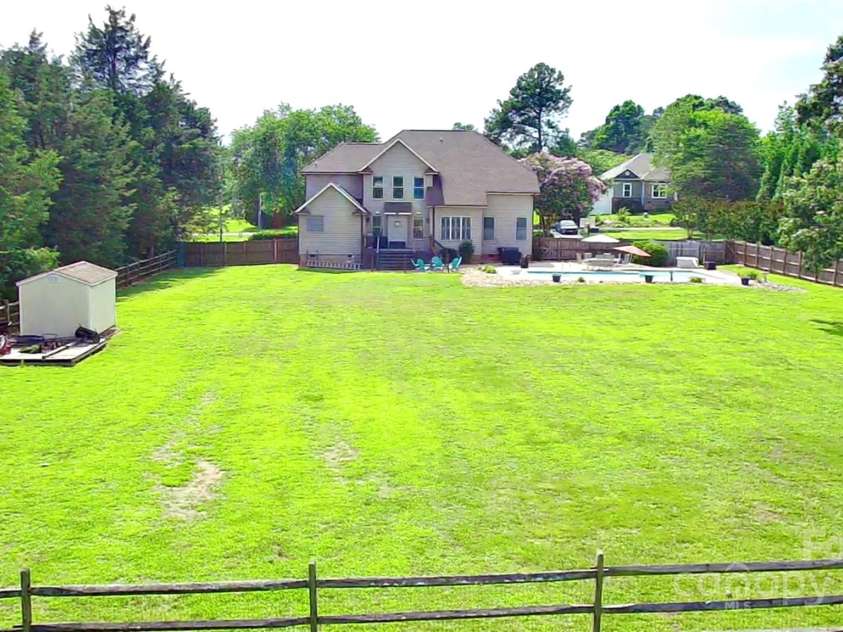 141 Weathers Creek Road, Troutman, NC 28166.  MLS# CAR4264721, YatesRealty ID 22900. Large backyard.