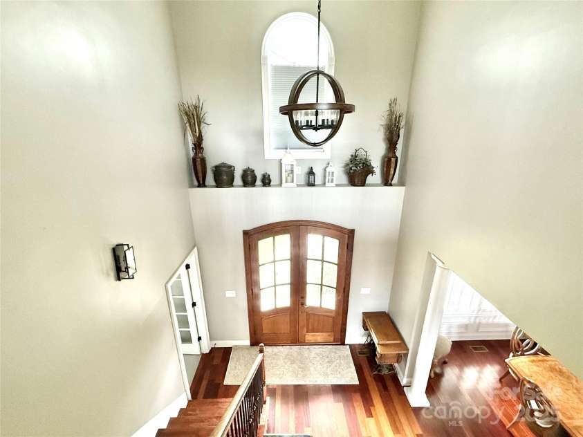 141 Weathers Creek Road, Troutman, NC 28166.  MLS# CAR4264721, YatesRealty ID 22900. Looking down from upper at the entryway.