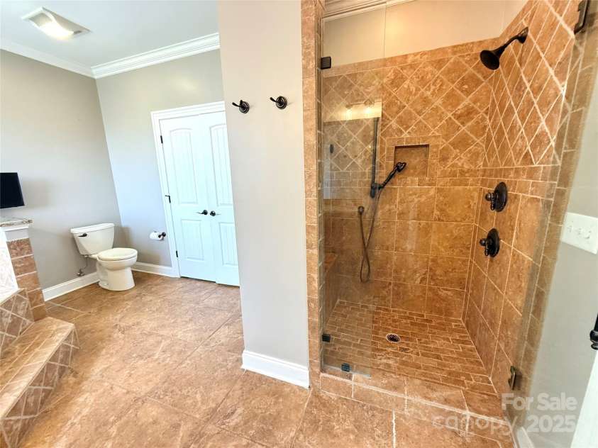 141 Weathers Creek Road, Troutman, NC 28166.  MLS# CAR4264721, YatesRealty ID 22900. Stand up custom tile shower in primary.