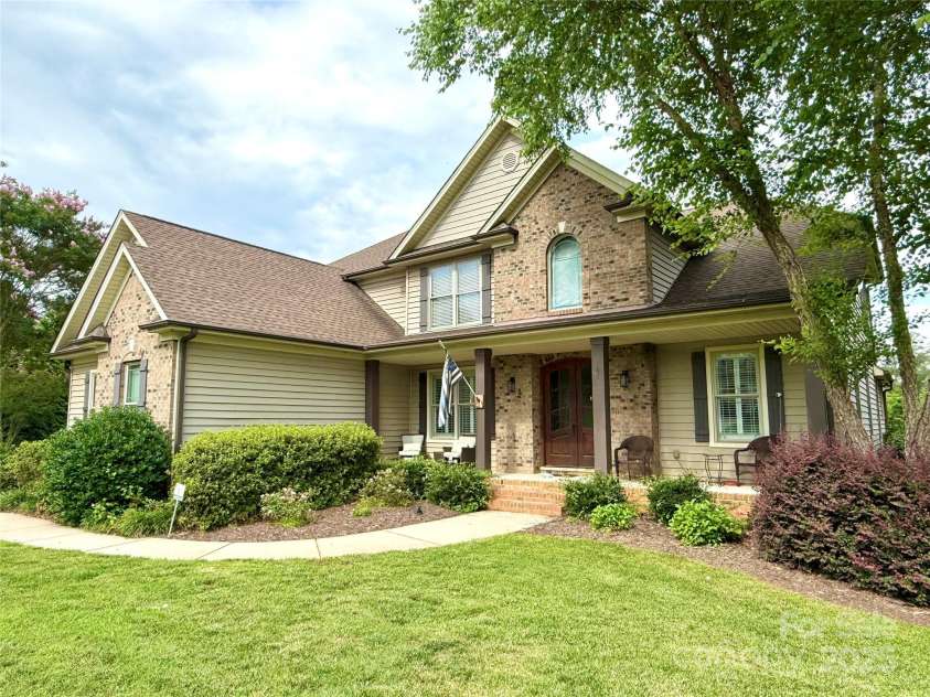 141 Weathers Creek Road, Troutman, NC 28166.  MLS# CAR4264721, YatesRealty ID 22900. Well maintained landscaping.