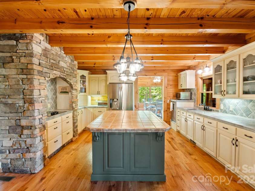 165 Perennial Drive, Nebo, NC 28761.  MLS# CAR4252202, YatesRealty ID 22902. Custom kitchen with island