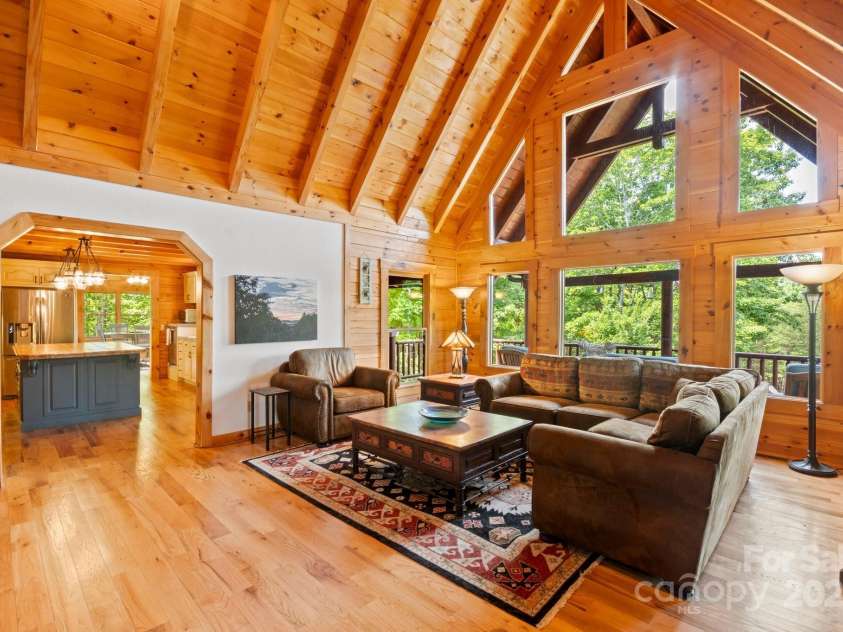 165 Perennial Drive, Nebo, NC 28761.  MLS# CAR4252202, YatesRealty ID 22902. Living room leading to kitchen