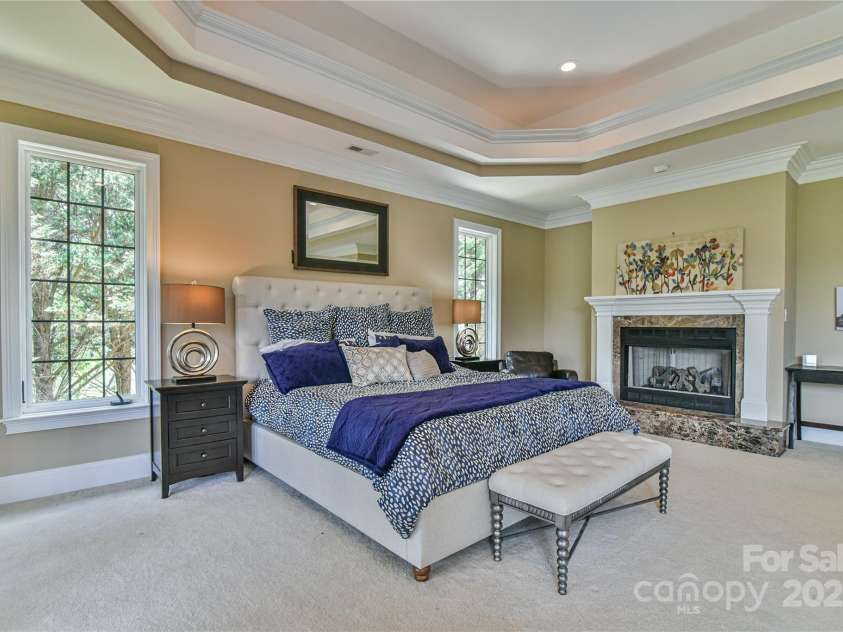 38 Bradford Vista, Fletcher, NC 28732.  MLS# CAR4274211, YatesRealty ID 22906. Primary bedroom with fireplace