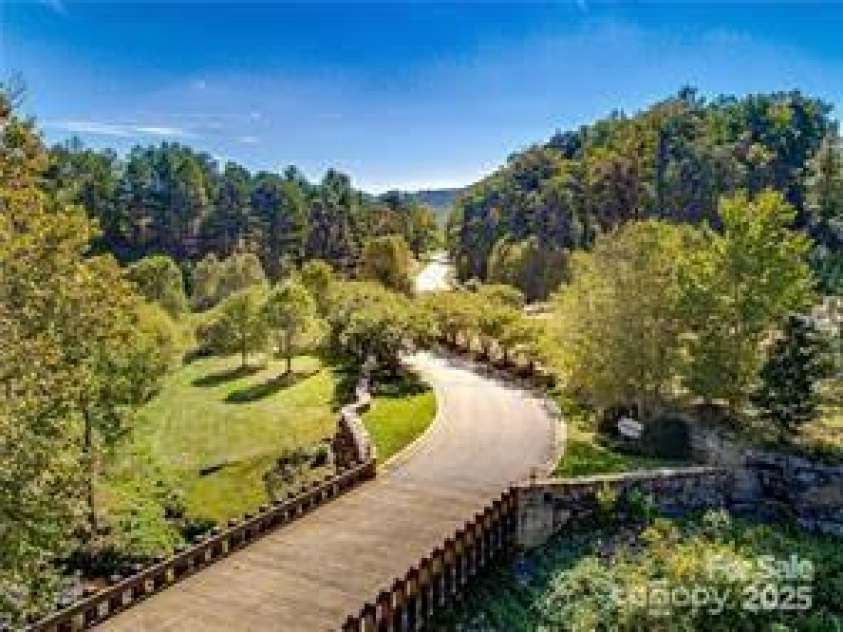 38 Bradford Vista, Fletcher, NC 28732.  MLS# CAR4274211, YatesRealty ID 22906. Waterford Lakes bridge entrance