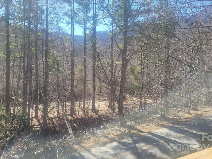620 Hickory Springs Road, Burnsville, NC 28714.  MLS# CAR4228193, YatesRealty ID 2291. Creek View from Front Deck