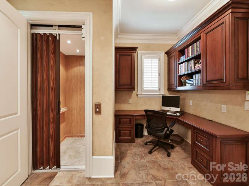14633 Rudolph Dadey Drive, Charlotte, NC 28277.  MLS# CAR4380661, YatesRealty ID 22910. Elevator and Home Command/desk area