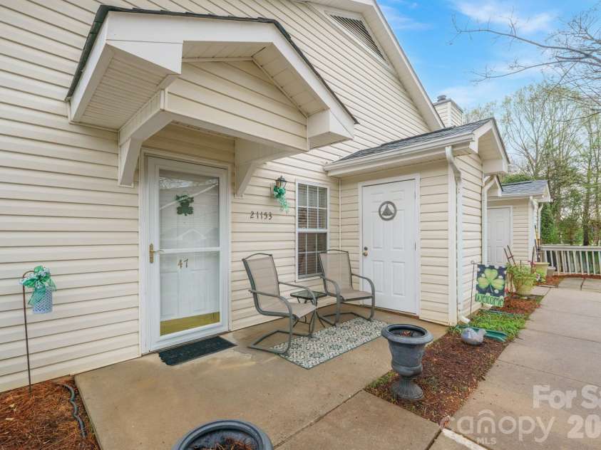 21153 Cold Spring Lane, Cornelius, NC 28031.  MLS# CAR4355327, YatesRealty ID 22914. Front Porch with Additional Storage Closet