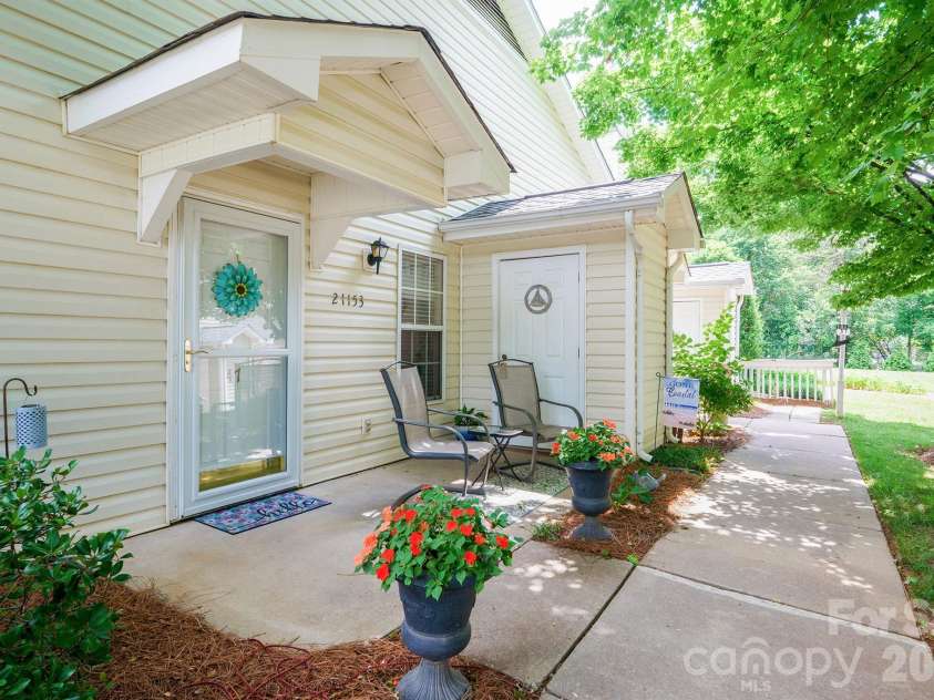 21153 Cold Spring Lane, Cornelius, NC 28031.  MLS# CAR4355327, YatesRealty ID 22914. Front Porch with Additional Storage Closet