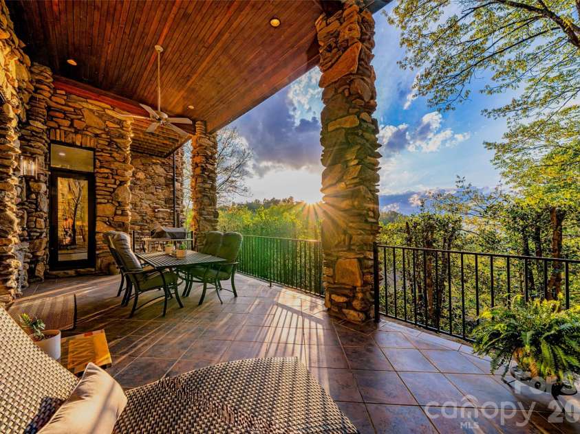8 Timberwolf Court, Asheville, NC 28804.  MLS# CAR4369628, YatesRealty ID 22918. Lower level deck with evening light