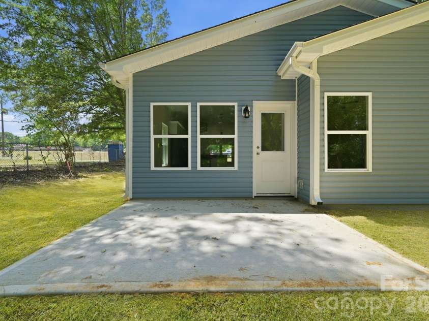 1150 Sloop Avenue, Kannapolis, NC 28083.  MLS# CAR4369219, YatesRealty ID 22923. Concrete Patio off the Back Door