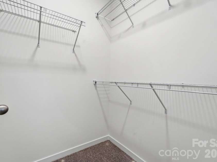 1150 Sloop Avenue, Kannapolis, NC 28083.  MLS# CAR4369219, YatesRealty ID 22923. Primary Bedroom's Walk-in Closet