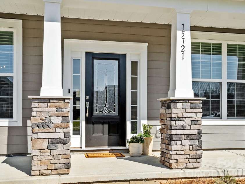 15721 White Quartz Lane, Davidson, NC 28036.  MLS# CAR4351942, YatesRealty ID 22924. Charming Southern front porch