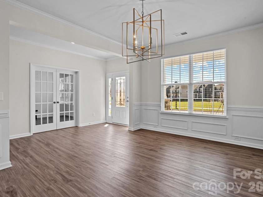 15721 White Quartz Lane, Davidson, NC 28036.  MLS# CAR4351942, YatesRealty ID 22924. Formal dining room across from the dedicated office