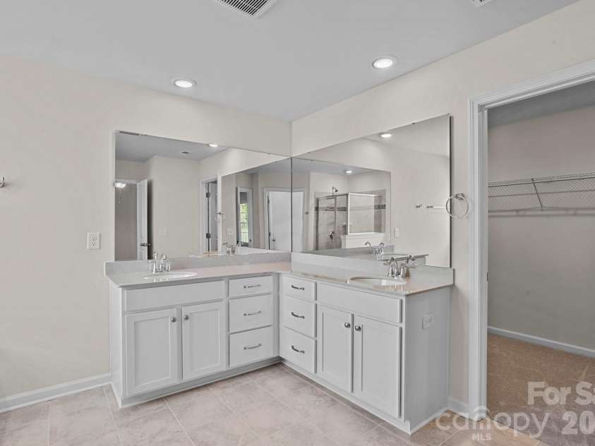 15721 White Quartz Lane, Davidson, NC 28036.  MLS# CAR4351942, YatesRealty ID 22924. L-shaped vanity