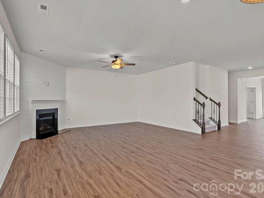15721 White Quartz Lane, Davidson, NC 28036.  MLS# CAR4351942, YatesRealty ID 22924. Shiplap millwork on the gas fireplace