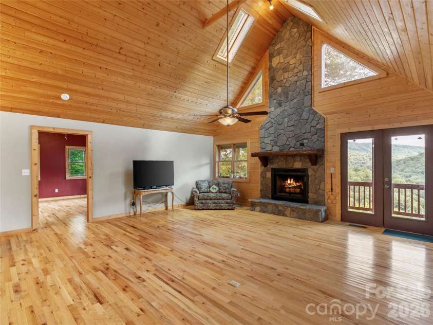 346 Appaloosa Trail, Burnsville, NC 28714.  MLS# CAR4312103, YatesRealty ID 2293. Great room w/wood burning fireplace
