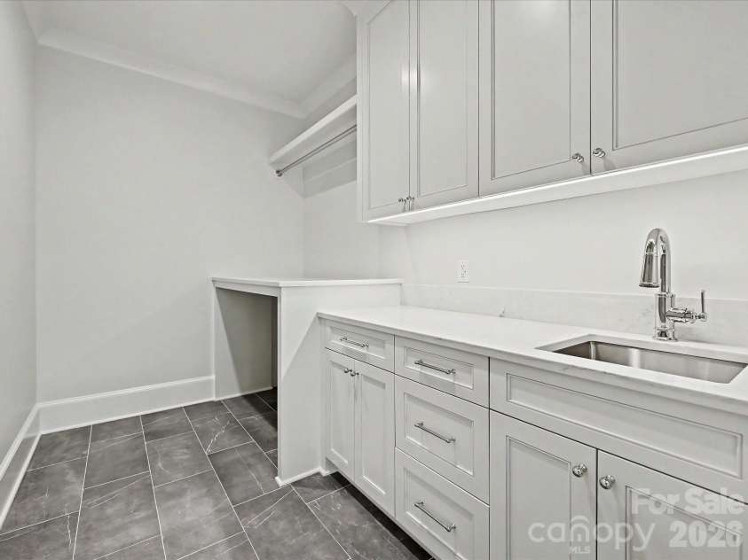 3701 Pelham Lane, Charlotte, NC 28211.  MLS# CAR4361615, YatesRealty ID 22930. Upstairs Laundry Room