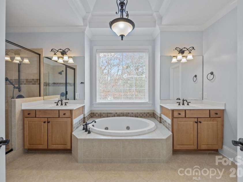 141 Winding Creek Drive, Troutman, NC 28166.  MLS# CAR4353880, YatesRealty ID 22933. The Primary Bathroom is such a sanctuary!
