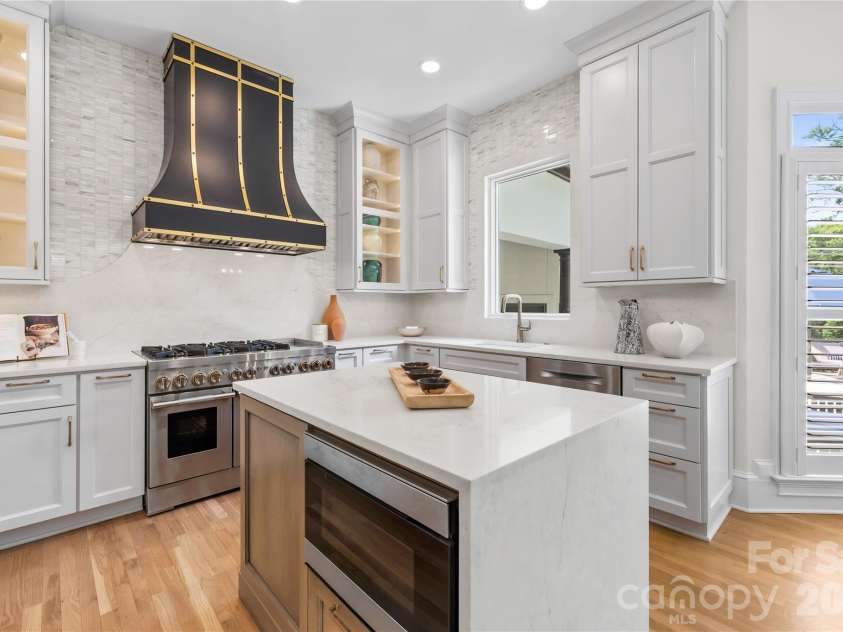 162 Dedham Loop, Mooresville, NC 28117.  MLS# CAR4378074, YatesRealty ID 22938. Kitchen Island w/ Sliding Microwave Drawer