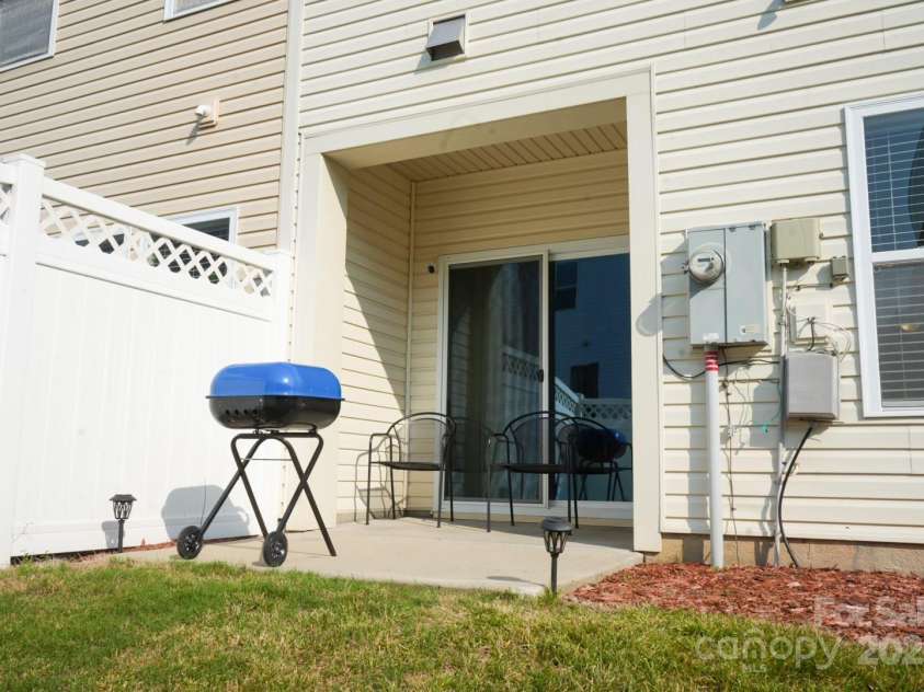 14411 Glendon Hall Lane, Charlotte, NC 28262.  MLS# CAR4268955, YatesRealty ID 22941. Back Patio