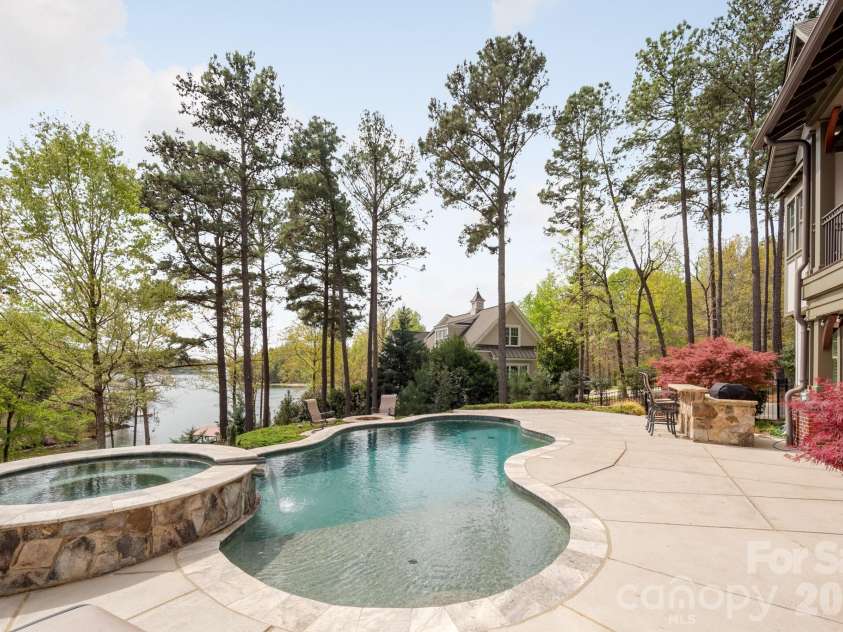 18321 Rosapenny Road, Charlotte, NC 28278.  MLS# CAR4364652, YatesRealty ID 22942. Pool, hot tub and firepit with bar on lower level