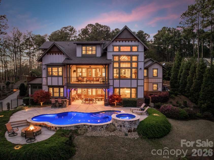18321 Rosapenny Road, Charlotte, NC 28278.  MLS# CAR4364652, YatesRealty ID 22942. Twilight of pool and firepit