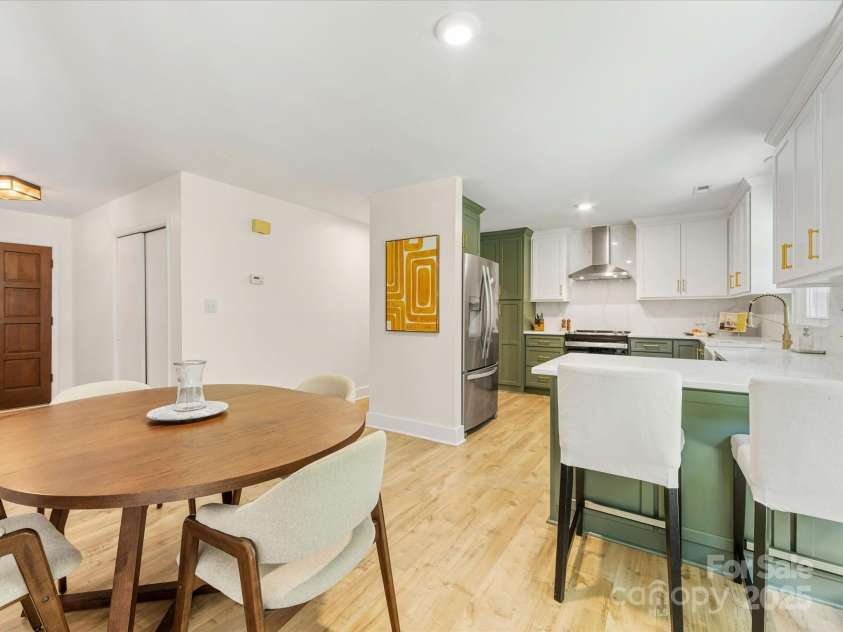 1115 Berry Ridge Road, Charlotte, NC 28270.  MLS# CAR4274309, YatesRealty ID 22944. Dining area leads to fully renovated kitchen!