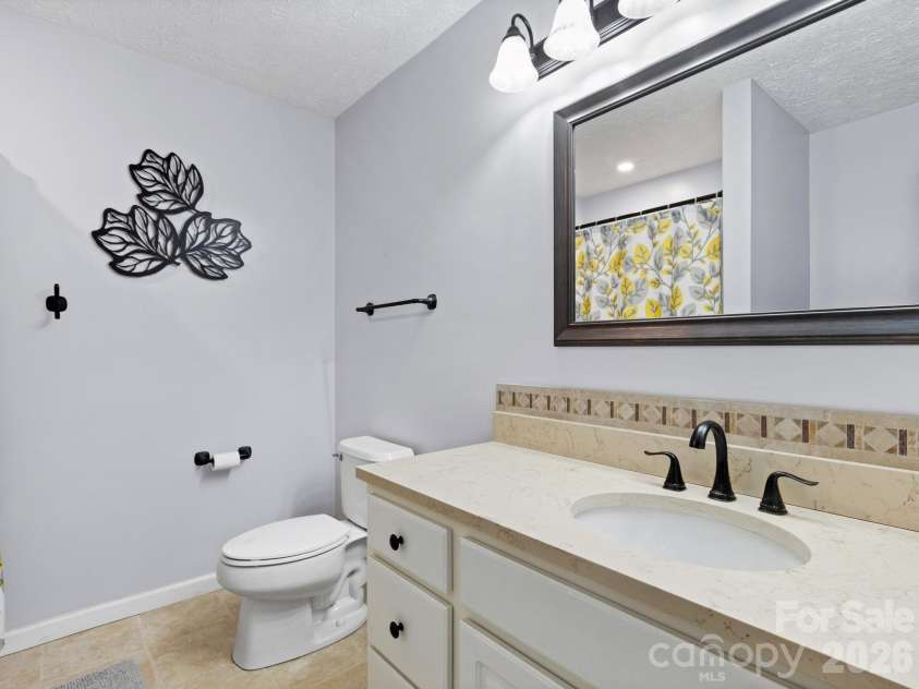 38 Brown Lynch Road, Candler, NC 28715.  MLS# CAR4377912, YatesRealty ID 22946. Primary's Full Bath