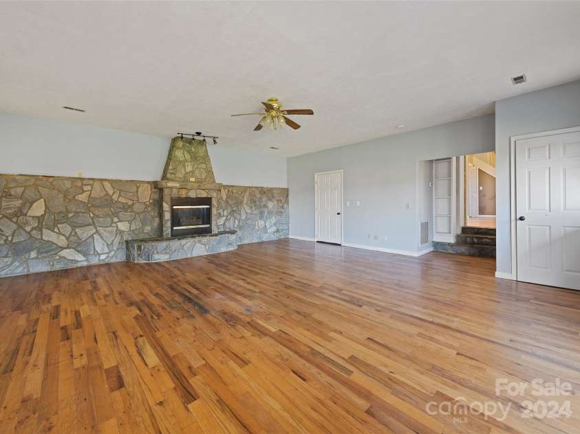 31 Lowe Drive, Waynesville, NC 28786.  MLS# CAR4203338, YatesRealty ID 2296. Family Room- Main Floor