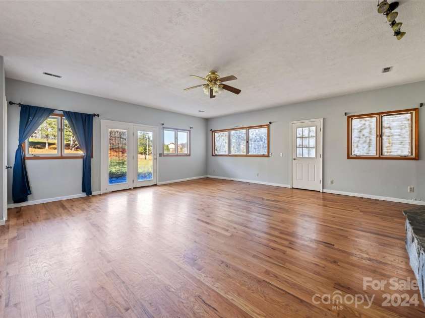31 Lowe Drive, Waynesville, NC 28786.  MLS# CAR4203338, YatesRealty ID 2296. Family Room- Main Floor