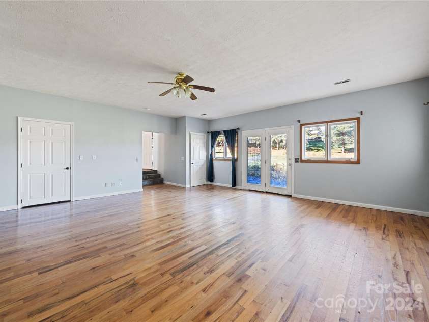 31 Lowe Drive, Waynesville, NC 28786.  MLS# CAR4203338, YatesRealty ID 2296. Family Room- Main Floor